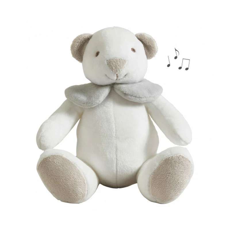Osito blanco de peluche con música